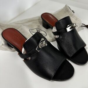 “Hermes” Black Leather Mules with Silver Accents